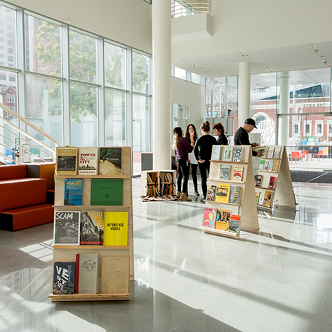 A set of book-shelves inside a museum atrium.