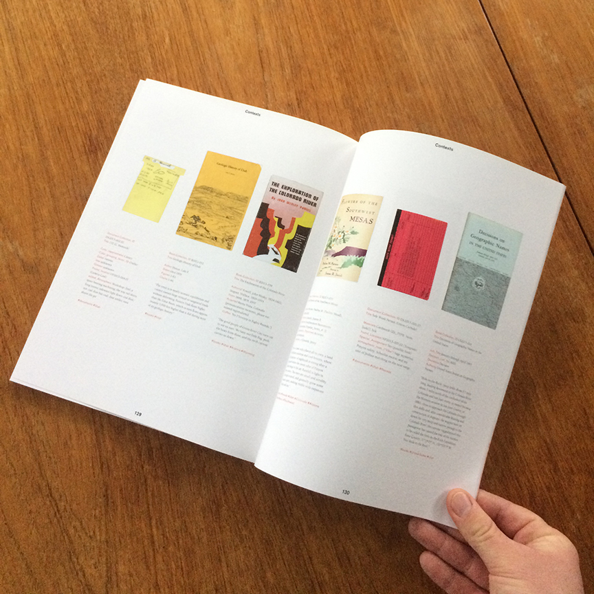 A magazine held open on a table.