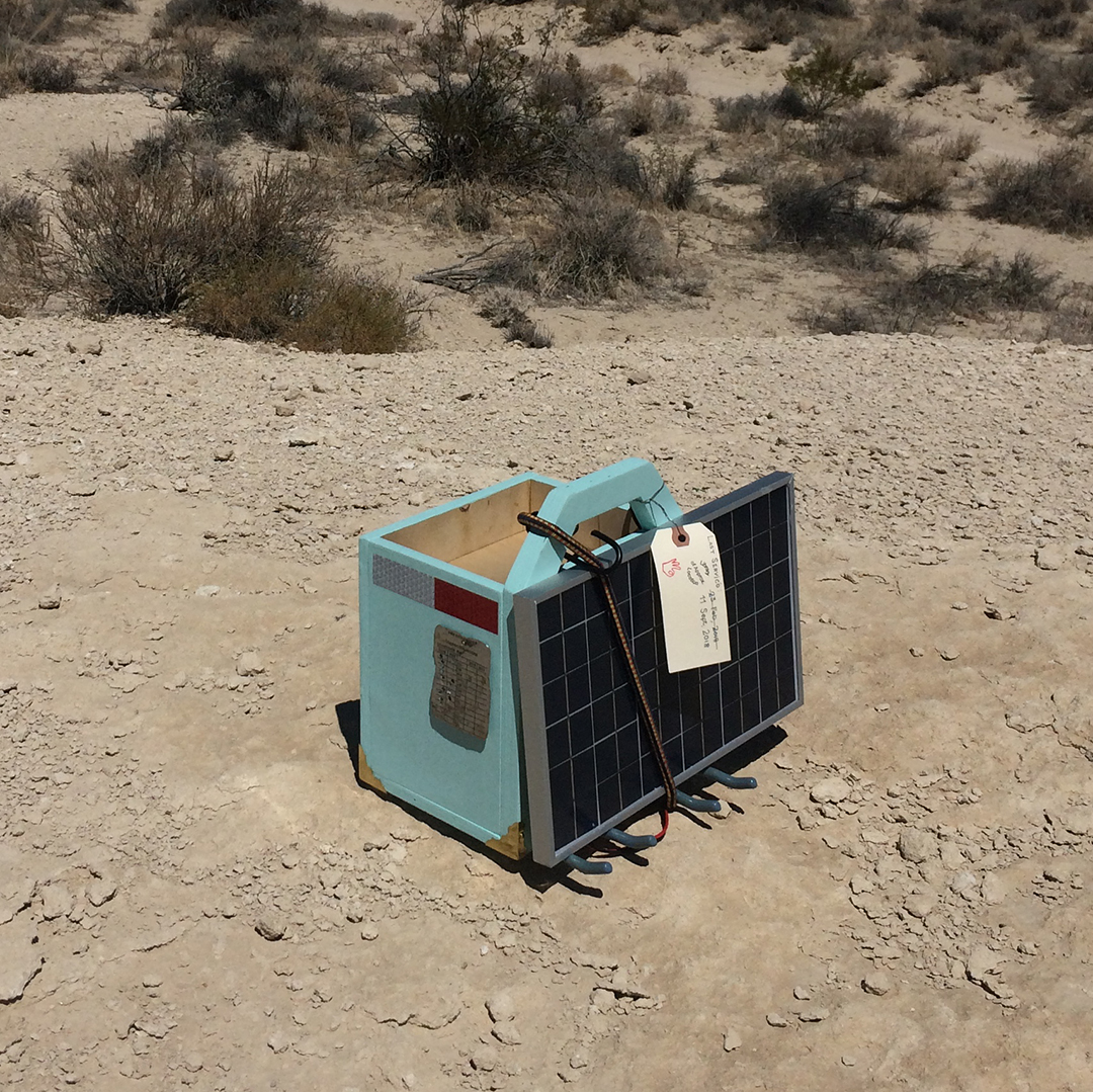 digital library carrying device sitting on rock