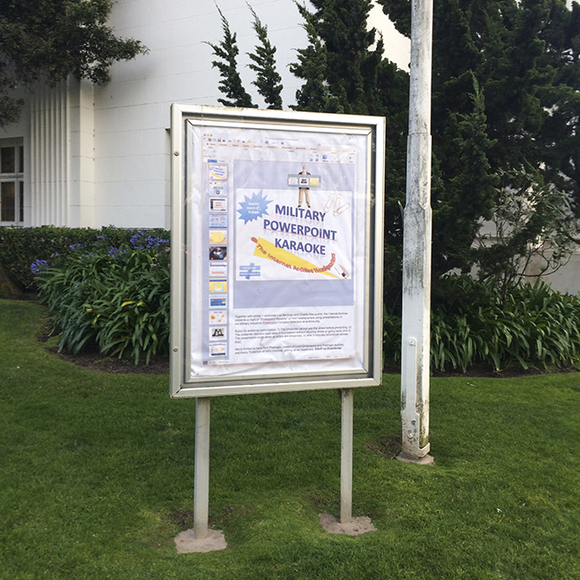 a church-front sign with the flyer for military powerpoint karaoke inside it