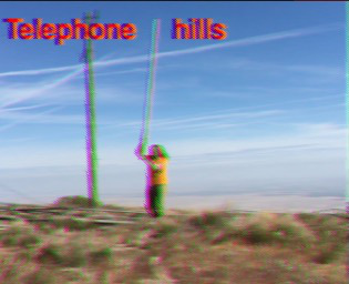 SSTV image showing person walking with radio antenna and text TELEPHONE HILLS